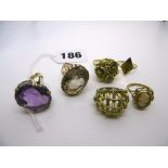 A large amethyst single-stone ring, a large citrine single-stone ring and four other rings FOR