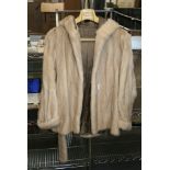A lady's pale blonde mink fur parka jacket with hood and belt [upstairs rail by silver shelves]