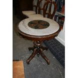 A Continental occasional table with multiple coloured circular marble top on a mahogany frame,