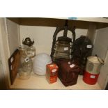 A selection of various oil lamps and oil heaters, a camera and a milk glass lampshade [bottom sZ]