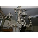 A five-branch scrolling painted metal chandelier with glass flowerhead drops FOR DETAILS OF ONLINE