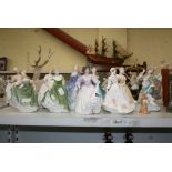 A collection of ten Royal Doulton porcelain figures of young women in crinoline dress, including