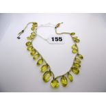 A citrine and pearl fringe necklet. FOR DETAILS OF ONLINE BIDDING ON THIS LOT CONTACT BAINBRIDGES.