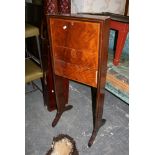 A late Victorian upright desk, the inlaid fall revealing a small fitted interior on trestle