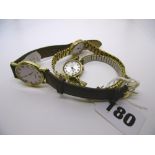 Three ladies' wrist watches and a box of decorative jewellery including porcelain flower brooches