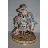 A 19th century Meissen group of a lady and gentleman with Cupid scattering roses, no. F63, 24 cm