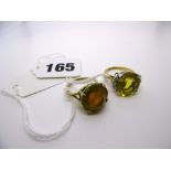A citrine and diamond ring and a citrine ring. FOR DETAILS OF ONLINE BIDDING ON THIS LOT CONTACT