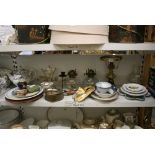 A large and miscellaneous selection on three shelves of pottery and porcelain, etc., that includes