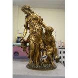A good 19th century French ormolu group of two Bacchantes, one standing, the other kneeling,