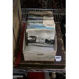 A shoebox of postcards filed by county and a file box of stamps and ephemera. FOR DETAILS OF