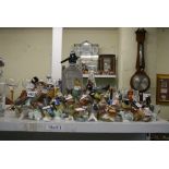 A shelf of bird ornaments including Goebels and Royal Worcester and including Robins and Wrens [