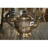 A silver teapot with inscription dated 1935, 15 ozt gross FOR DETAILS OF ONLINE BIDDING ON THIS