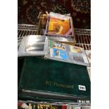 Two green plastic files full of BT Phone cards and a smaller folder of cards, two ET puzzles, a