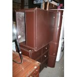Brown leather covered furniture stitched in cream comprising a chest of three drawers and a coffee