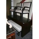 A modernist dark-stained desk with two beech-lined drawers and a pair of contemporary armchairs each