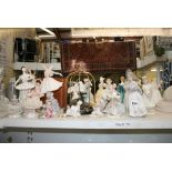 A selection of English and Continental porcelain figures, including Lladro, Coalport, and mainly