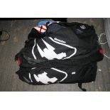 Two sports bags with wet suits and other diving gear, including a pair of flippers [Garage, floor by
