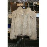 A lady's platinum fox fur short jacket with SAGA label [upstairs rail by silver shelves] FOR DETAILS
