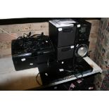A computer and sound system, Samsung laser printer, and Vestel sound system [G28] FOR DETAILS OF