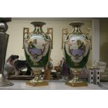 A pair of large Noritake porcelain vases, painted with landscapes within raised gilt borders on a