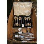 English silver, comprising: six teaspoons with tongs, in a case; five Albany coffee spoons; napkin