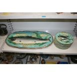 A Victorian Wedgwood majolica fish service, comprising an oval dish moulded with a salmon and 11