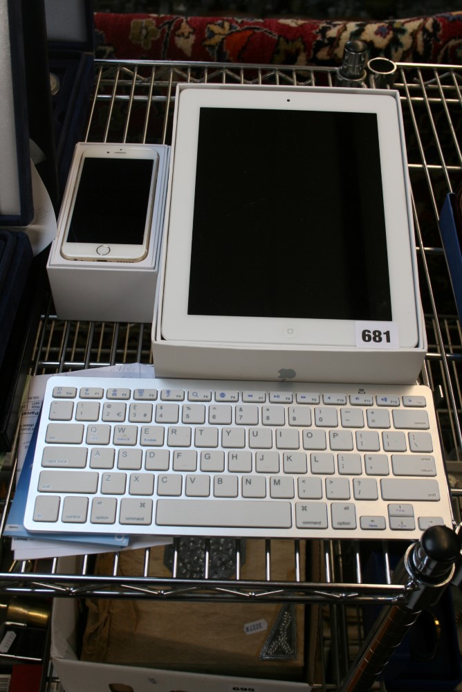 An Apple iPod and Apple Phone 6 and keyboard. FOR DETAILS OF ONLINE BIDDING ON THIS LOT CONTACT
