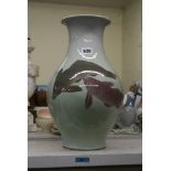 A large Japanese porcelain vase by Makuzu Kozan, early 20th century, painted with three swimming