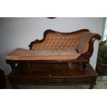 An early Victorian mahogany chaise longue with a scrolling end and buttoned back within a moulded