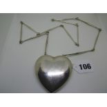 A Georg Jensen necklace comprising a large silver heart on a rod chain design 126, marked and