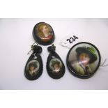 Two Whitby jet and portrait plaque brooches, and a pair of Whitby jet and portrait plaque earrings