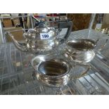 A George V silver three-piece tea set, oblong with black handles and knop, Birmingham 1919, 25.3 ozt