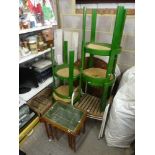 A stylish 1970s wooden garden table of circular form with slatted wood on a folding stand and two