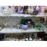 A shelf of good glassware including a Bohemian set of coloured hock glasses, green stem wine