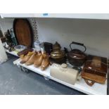 Two shelves of bygones, including vintage shoe trees, late Victorian horseshoe stirrup-cup tray,