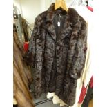 A lady's dark brown mink fur coat of textured design [rail top of stairs] FOR DETAILS OF ONLINE
