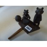 A modern Black Forest toy depicting a drum-playing bear and his high-kicking friend FOR DETAILS OF