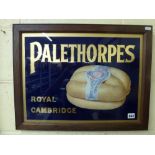 A vintage advertising sign for Palethorpes Royal Cambridge Sausages, reverse-applied to glass, oak