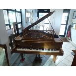 A baby grand piano by Chappel in a walnut case raised on square tapering legs. FOR DETAILS OF ONLINE