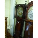 A George III mahogany long-case clock the arched steel and brass dial with sun face roundel framed