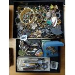 A box of costume jewellery including diamante, amethyst-mounted earrings, seven wristwatches, a