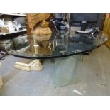 A very smart contemporary dining table the clear oval bevelled glass top on twin glass supports. FOR