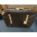 A Louis Vuitton zippered suitcase, circa 1980s, in monogram print with leather trim [upstairs end