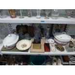 A shelf of decorative items, including two white vegetable dishes, 19th century and later French