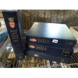 Three Royal Mail stamp albums each in its storage box, designed to house a basic collection of
