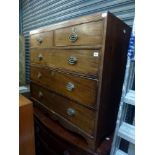 An early 19th century mahogany chest of two short over three long drawers above a shaped inlaid