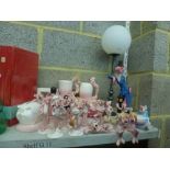 A fun collection of Pink Panther figurines, table lamps, mugs, money-boxes, egg-cup, etc. [G11]