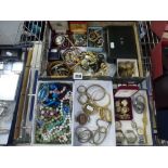 Four boxes of costume jewellery including a Victorian memorial brooch set with hair, an enamelled