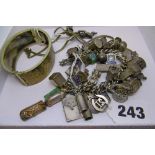 A silver charm bracelet with assorted charms, together with a white metal engraved bangle and