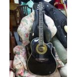 An acoustic Fighter guitar with paper label in carry case FOR DETAILS OF ONLINE BIDDING ON THIS